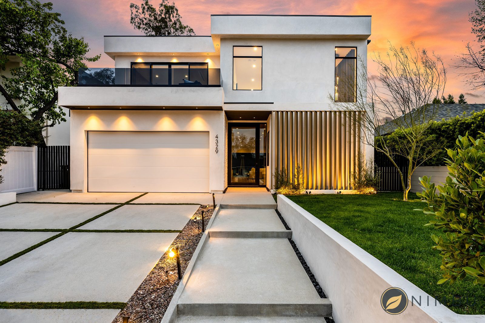 a home with some lights on is very neat and white